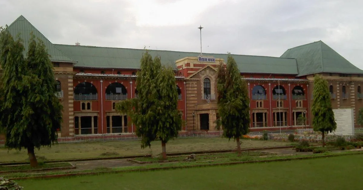 The red-brick Vidhan Bhavan building in Nagpur with its green roof and front lawn